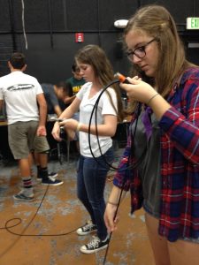 Students learn to wrap XLR audio cables correctly.